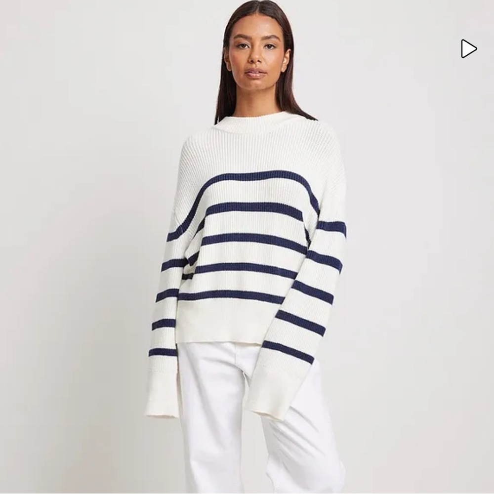 Never worn. Knitted striped sweater